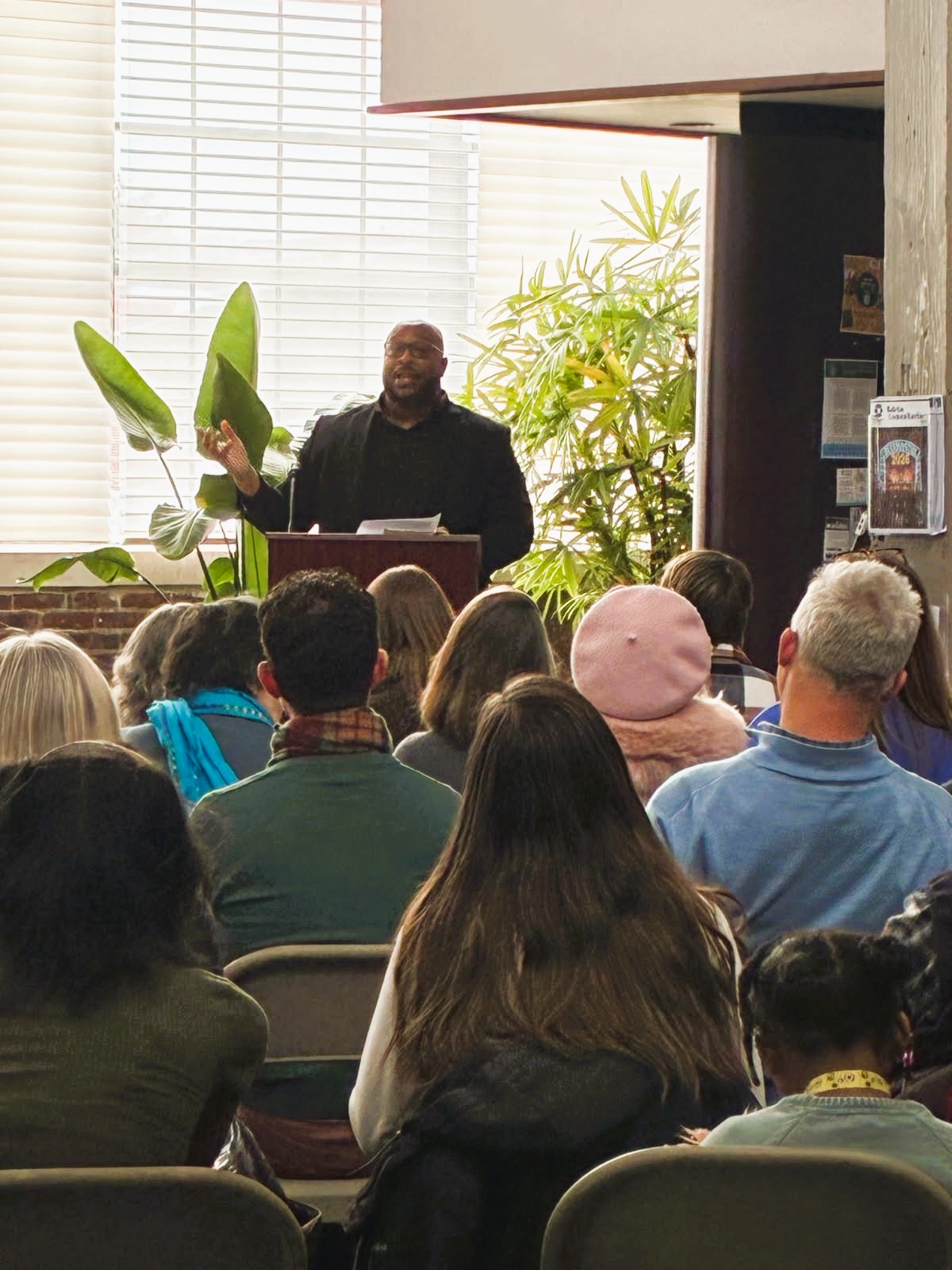 Leon Gordon speaking at the podium